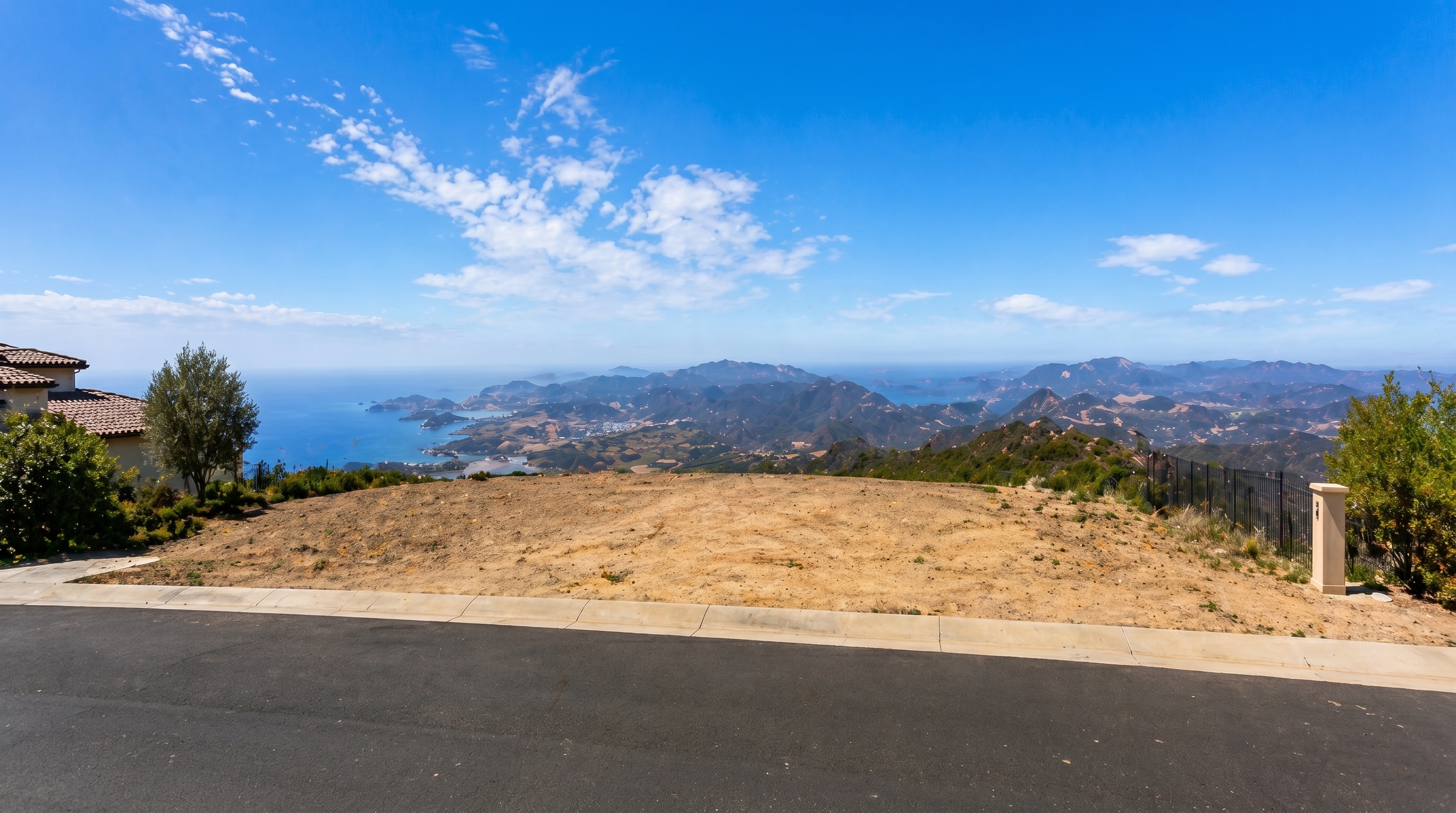 First frame showing an empty hillside lot overlooking the ocean